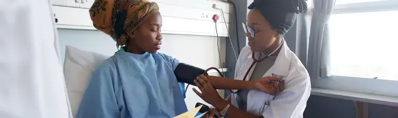 Patient in hospital with nurse"