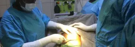 Naomi Lewis, performing a Cesarean Section in Liberia. 