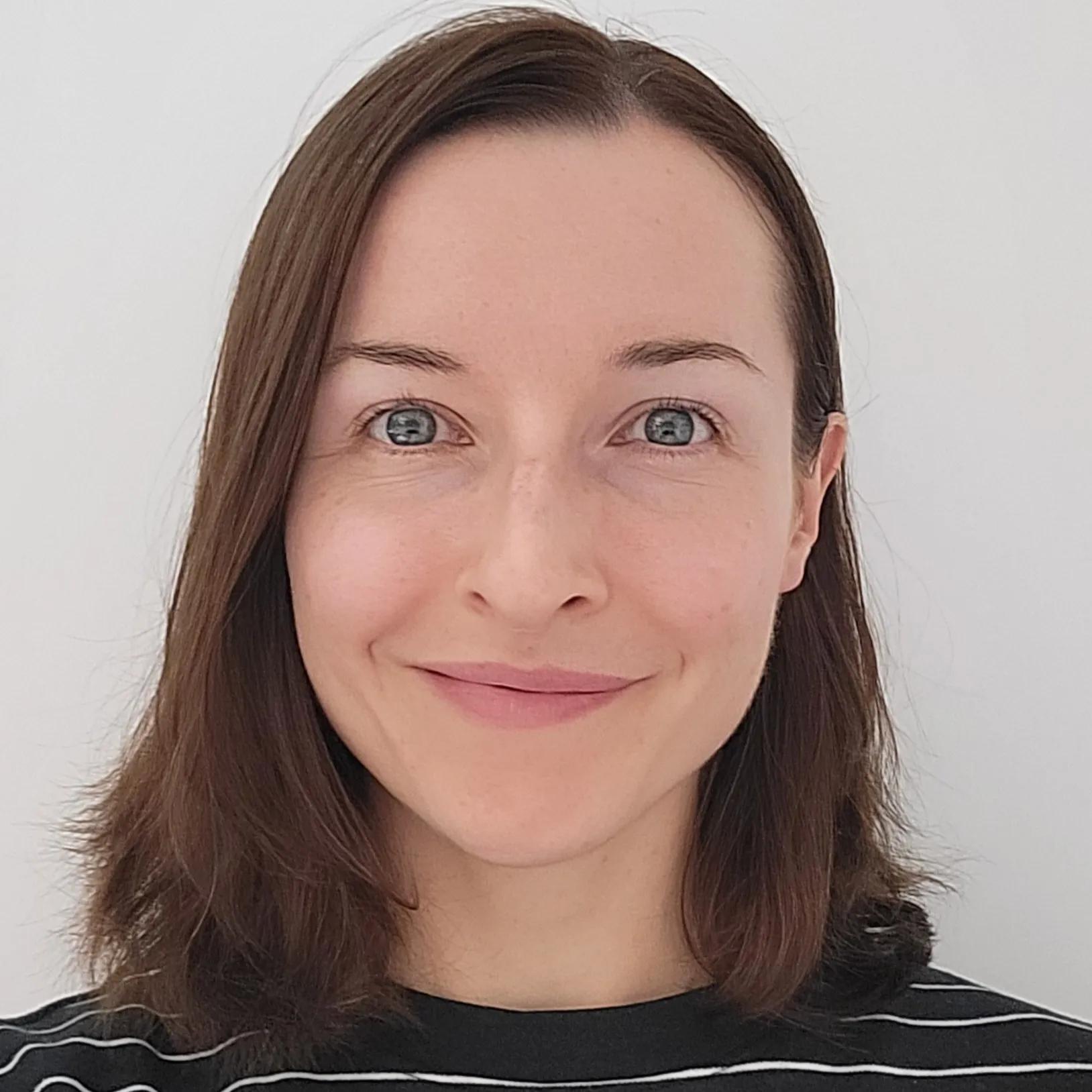 Gemma gives a friendly smile to the camera in her headshot image