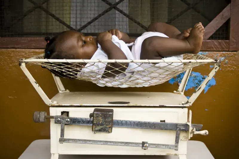 Baby in a weighing scale