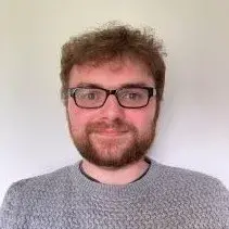 Graeme is smiling warmly at the camera in this headshot image