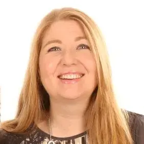 Sharon is smiling warmly at the camera in this headshot image