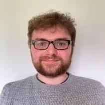 Graeme is smiling warmly at the camera in this headshot image