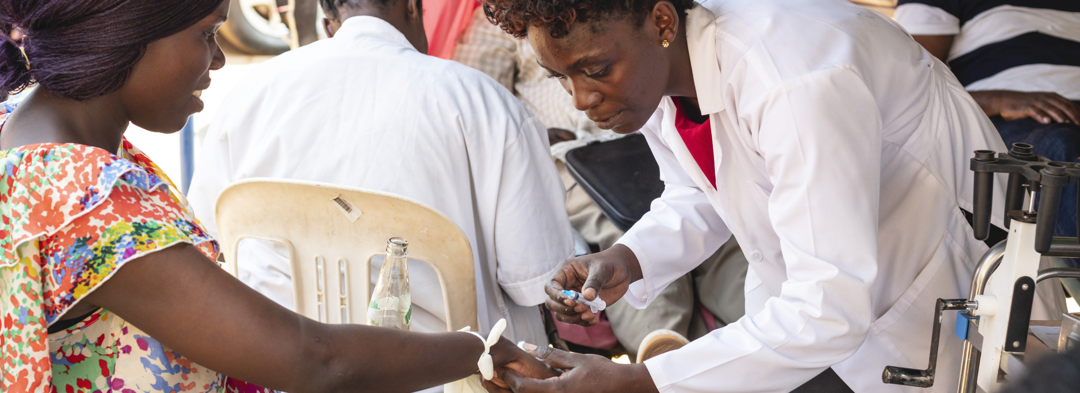 Health worker giving an injection